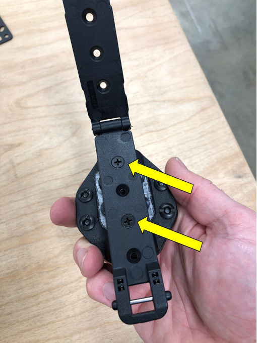 "Flat Head" screws securing the MOLLE-Lok